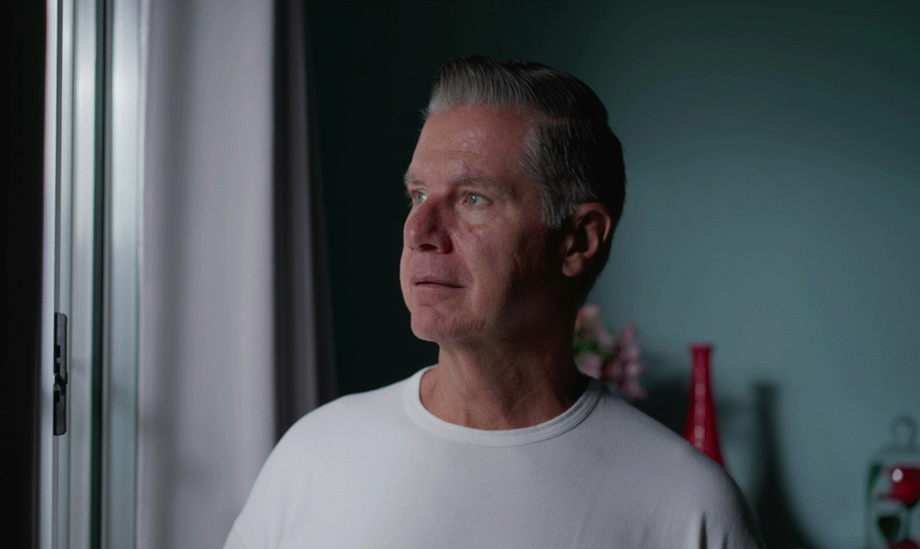 Over Worked, Over Stressed and Over 50??? Here’s How to Get Your Spark for Life Back 53 year old ,man looking out his window dreading the day