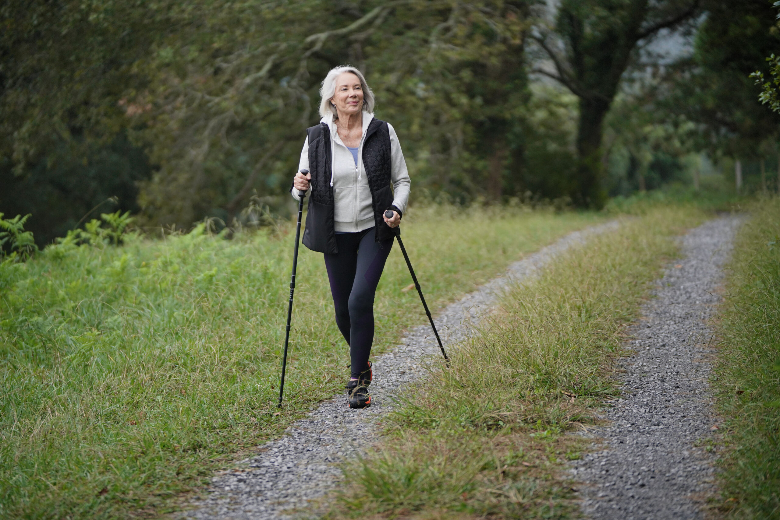senior woman hiking in countryside