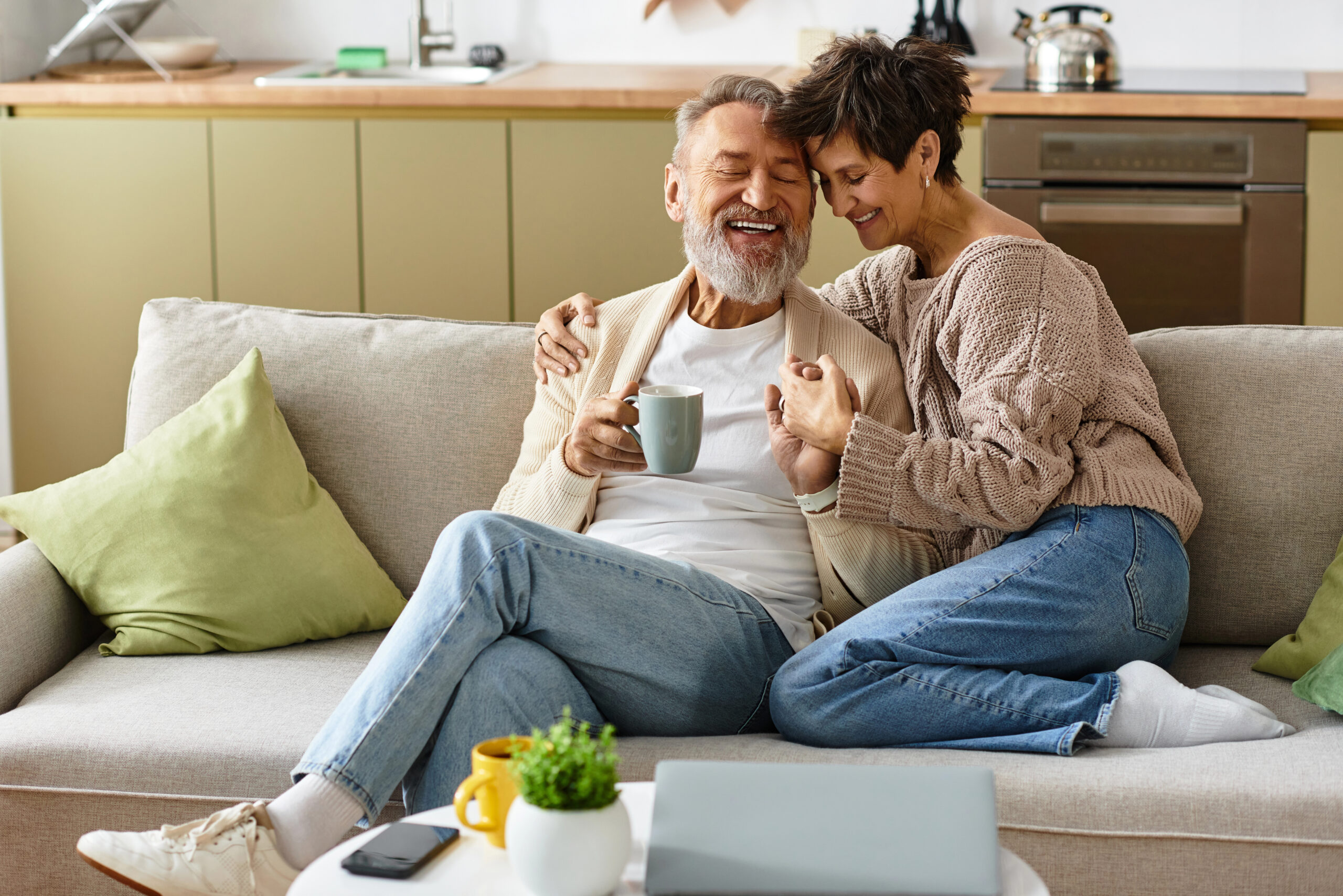 Mature couple relaxing on their couch together