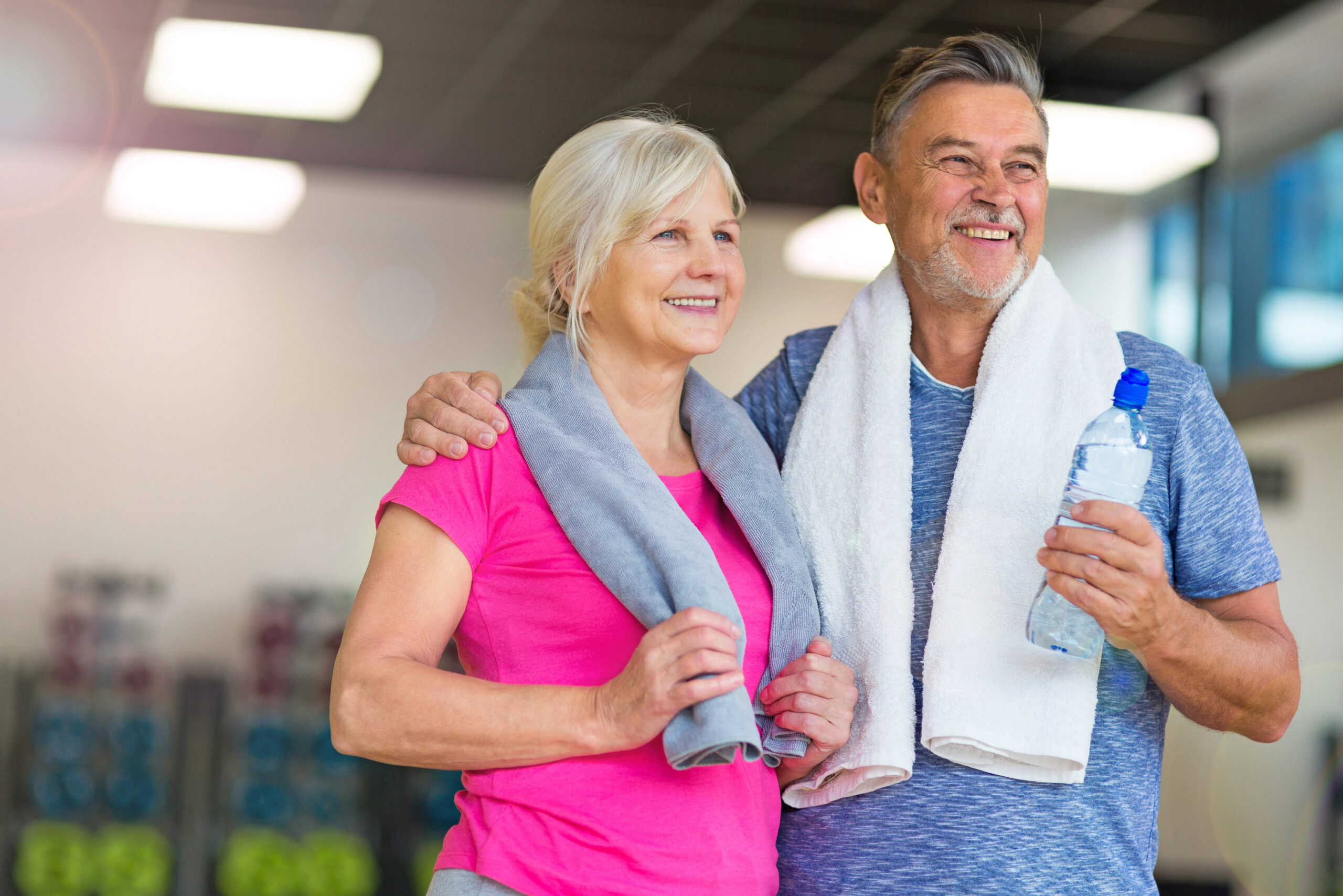 couple back in the gym after 50 finishing up their workout